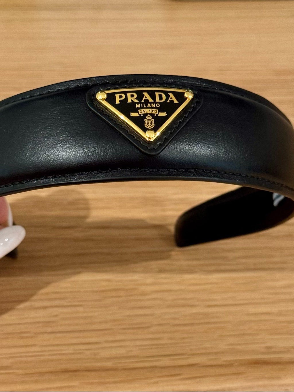 Prada Black Leather Headband With Gold Triangle Logo